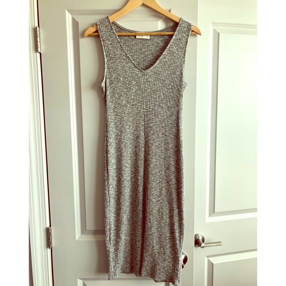Everly body-con dress with slit in the front!